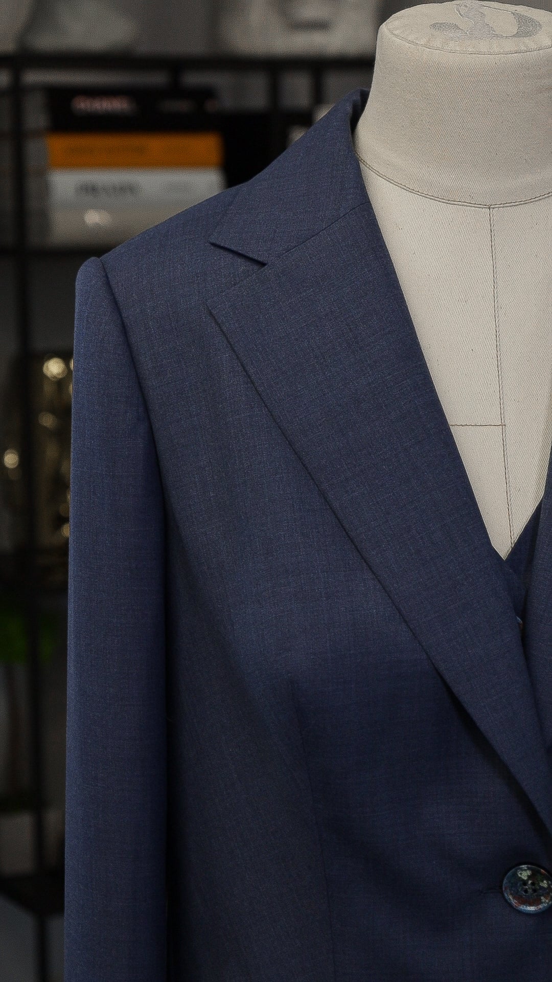 Blue four-piece suit made of wool with a silk lining.