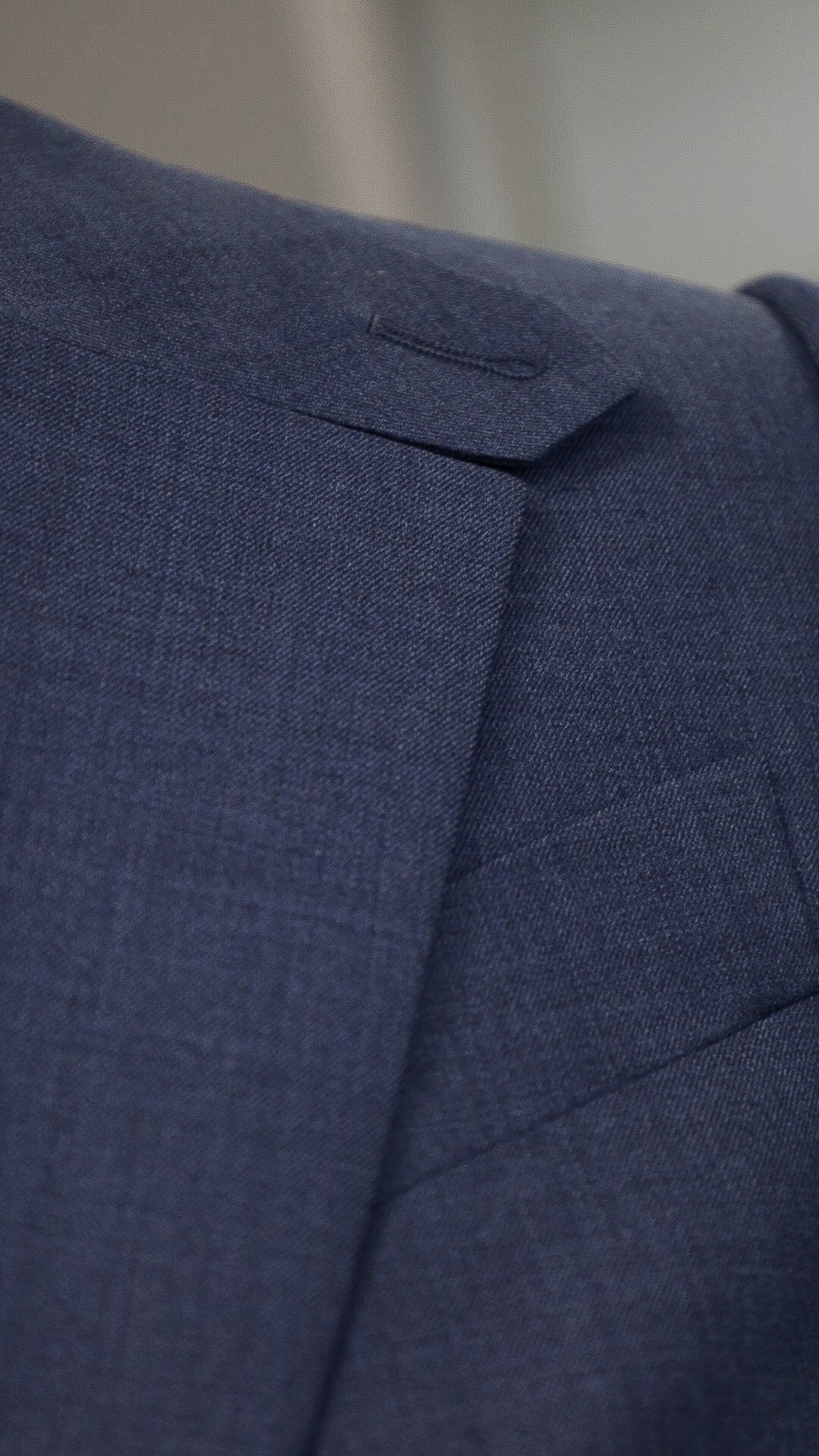 Blue four-piece suit made of wool with a silk lining.