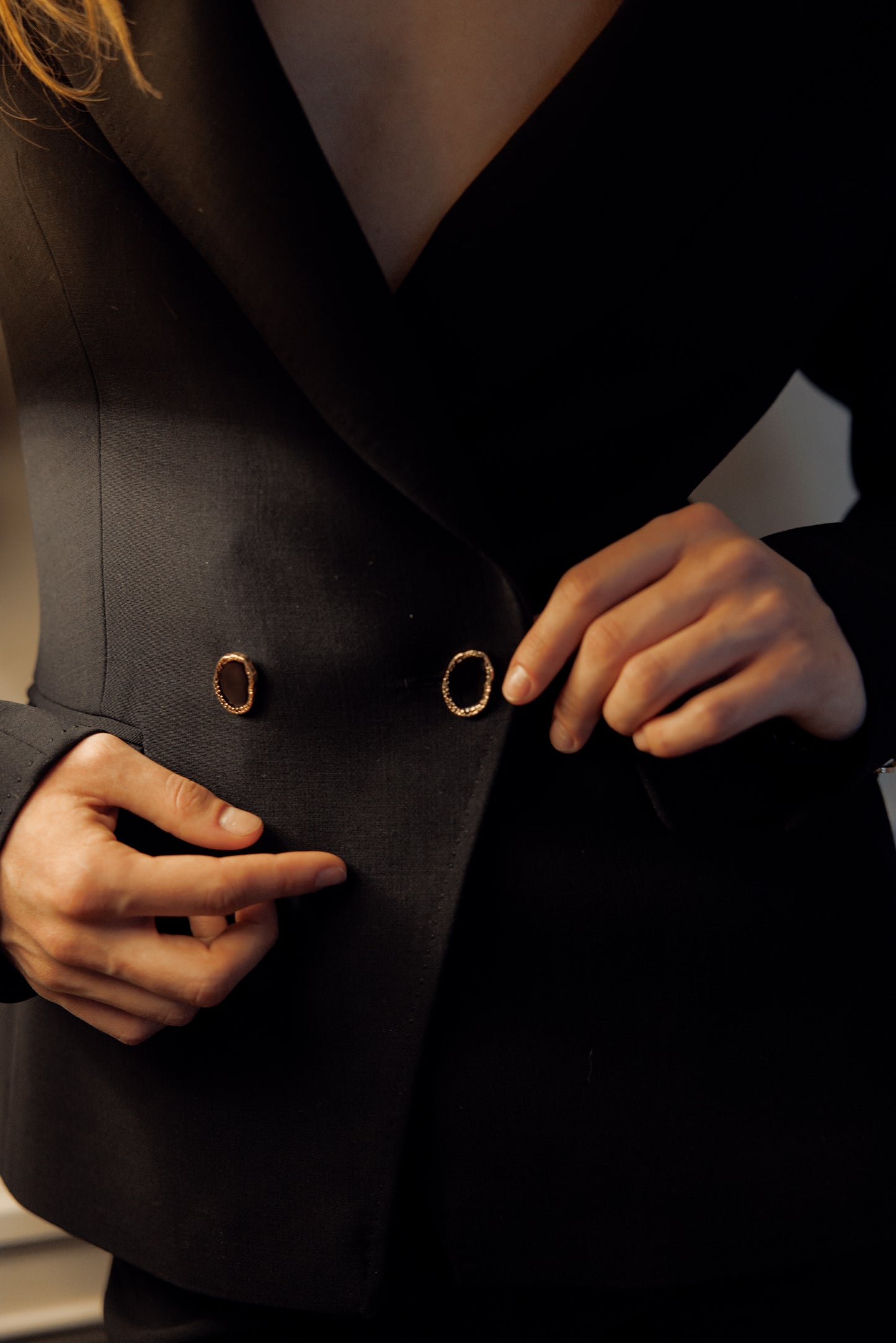 Black four-piece suit made of wool with a silk lining.